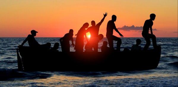 Depositphotos 84287594 stock photo boat with migrants